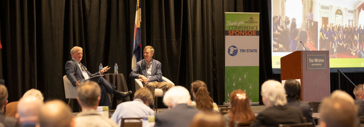 US Senator John Hickenlooper and CREA Executive Director Kent Singer chat during the CREA Energy Innovations Summit.