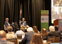 US Senator John Hickenlooper and CREA Executive Director Kent Singer chat during the CREA Energy Innovations Summit.