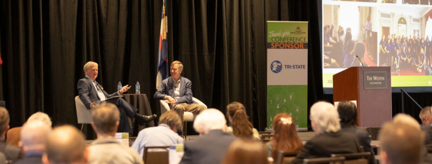 US Senator John Hickenlooper and CREA Executive Director Kent Singer chat during the CREA Energy Innovations Summit.