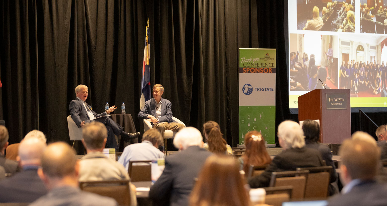 US Senator John Hickenlooper and CREA Executive Director Kent Singer chat during the CREA Energy Innovations Summit.